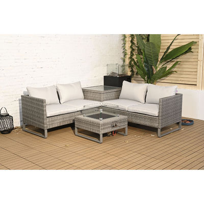 Außensofa aus Rattan mit Feuerstelle und Lagertisch