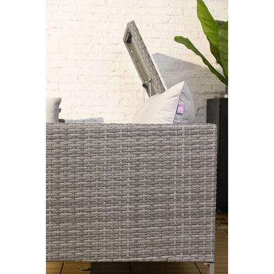 Außensofa aus Rattan mit Feuerstelle und Lagertisch