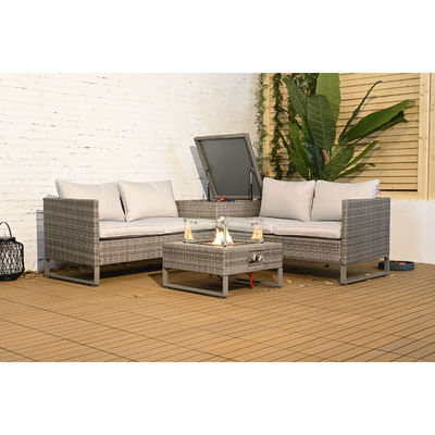 Außensofa aus Rattan mit Feuerstelle und Lagertisch